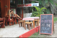        Burger Rancho Sign With Two Ladies Talking
  - Costa Rica