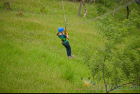        Young Girl Riding A Cable On Blue River Zipline Rincon De La Vieja
  - Costa Rica