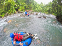        Lady Floating On A Tube Getting Ready To Enter The Rapids Blue River Rincon De La Vieja
  - Costa Rica