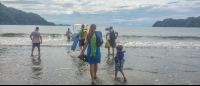        walking to boat tortuga island tour 
  - Costa Rica