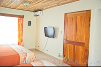        Premium Room Bedroom Tv Ac Unit And Door Los Lagos Resort
  - Costa Rica
