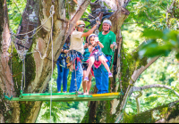        Kid Riding By Herself From A Tree Platform Tizati Zip Line Rincon De La Vieja
  - Costa Rica