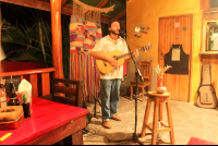        Guitar Man Playing At Al Chile Voila
  - Costa Rica