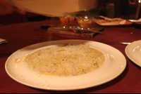        grating cheese on black truffle cream ravioli 
  - Costa Rica