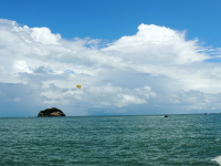        parasailing in the distance 
  - Costa Rica