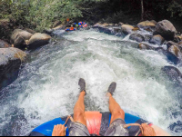        White Water And People Floating In Front Rio Negro Tubing Rincon De La Vieja
  - Costa Rica