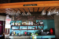        bar area sign it is what it is 
  - Costa Rica