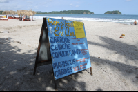        el ancla sign on beach 
  - Costa Rica