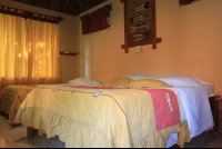        Ritmo Tropical Hotel Beds On Bungalow
  - Costa Rica
