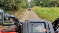        atv nosara tour guide going in front on a dirt trail
  - Costa Rica