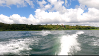        a make jumping above lake arenal as he wakeboards
  - Costa Rica