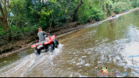        atv nosara tour crossing a creek
  - Costa Rica