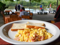        Scramble Eggs With Ham And Toast At Perla Del Sur Restaurant
  - Costa Rica