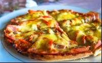        Pizza Closeup Osa Palmas Restaurant
  - Costa Rica