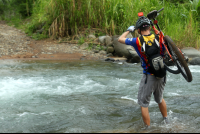        bamboo forest moutain bike tour crossing river 
  - Costa Rica