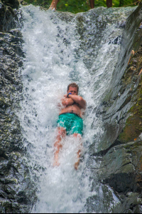       Man Sliding On Uvita Waterfall Waterfall Tour Manuel Antonio
  - Costa Rica