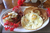        costa coral breakfast pancakes bacon eggs 
  - Costa Rica