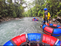        Tubing In A Section Of Calm Water Blue River Rincon De La Vieja
  - Costa Rica
