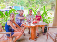        People Enjoying Fresh Fruit After Corcovado Canopy Tour
  - Costa Rica