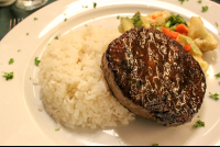        grilled steak with rice and vegetables at mastico restaurant 
  - Costa Rica