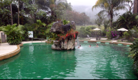        paradise hotsprings main pool waterfall 
  - Costa Rica
