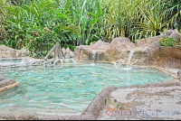        Los Lagos Hot Springs Cement Pool With Small Waterfall
  - Costa Rica